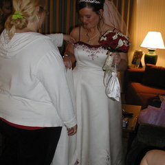 Getting into the dress.