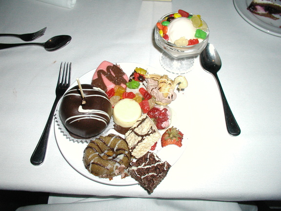 Chocolate covered apple, chocolate rice crispy treats, strawberried, chocolate mouse swan, and fudge.