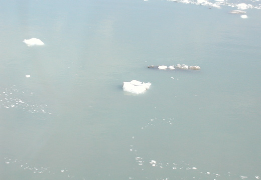 A small iceberg floating in the ocean.