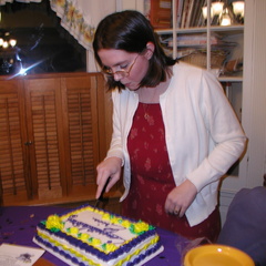 Erica cutting the cake