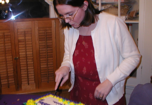 Erica cutting the cake