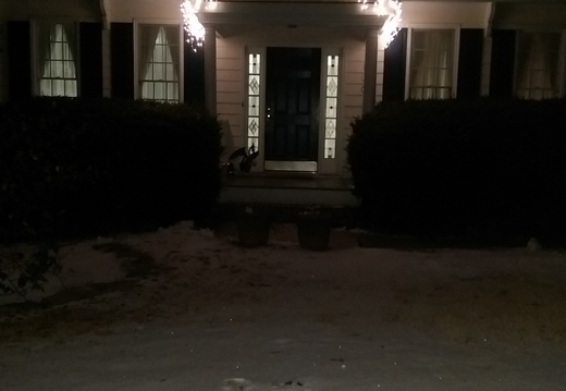 Front of house with January holiday snow